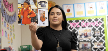 Teacher holding card